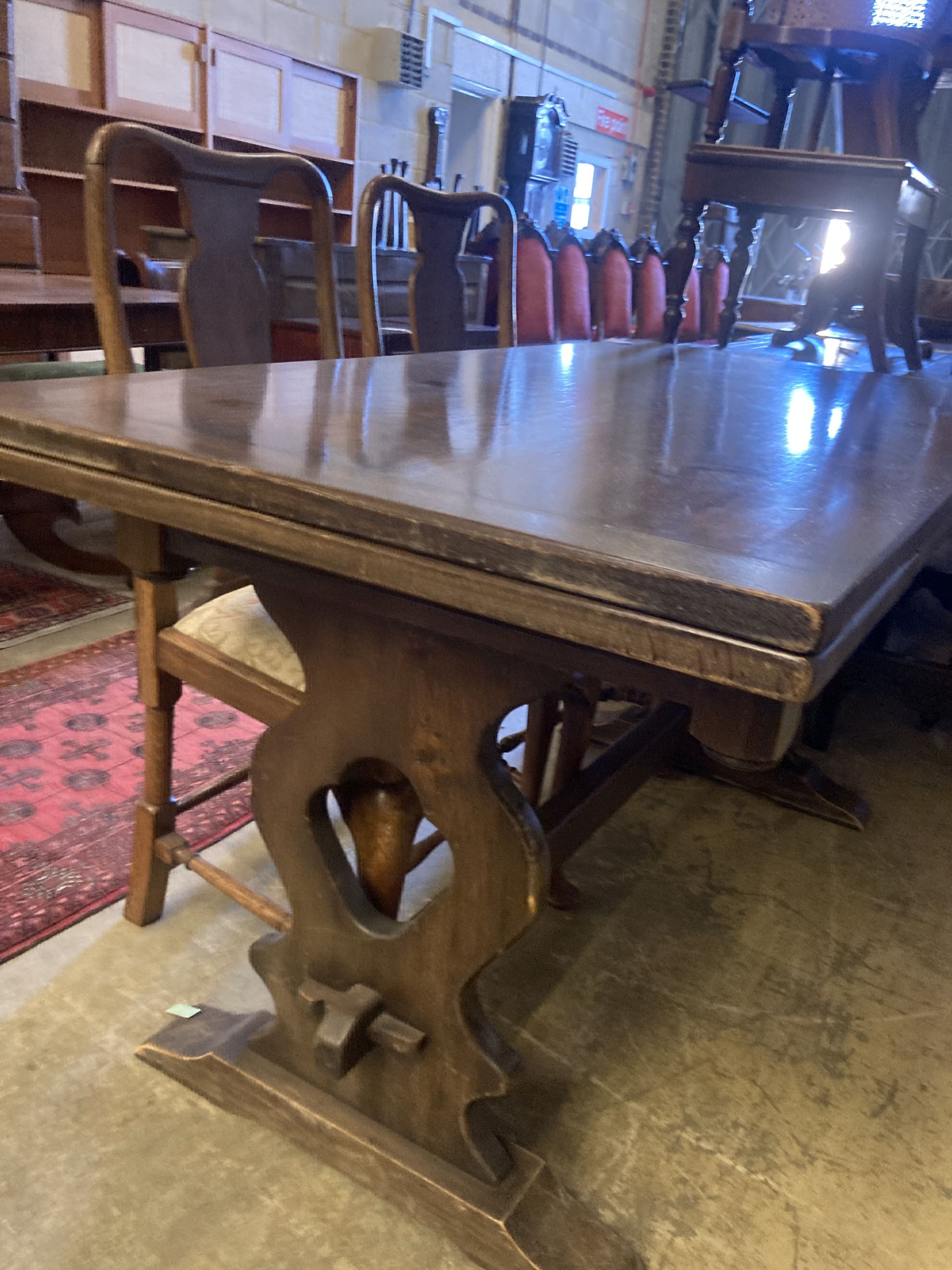 An 18th century style oak draw leaf dining table, width 150cm, depth 75cm, height 77cm